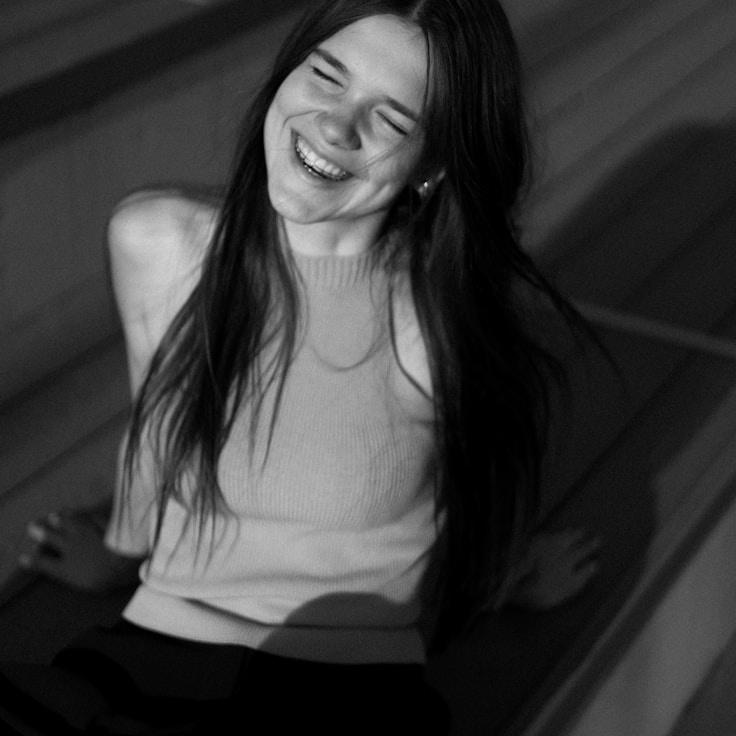 Riya Desai, Lead Design Curator at GroveBridgeAtlas, reviewing corporate floral arrangements